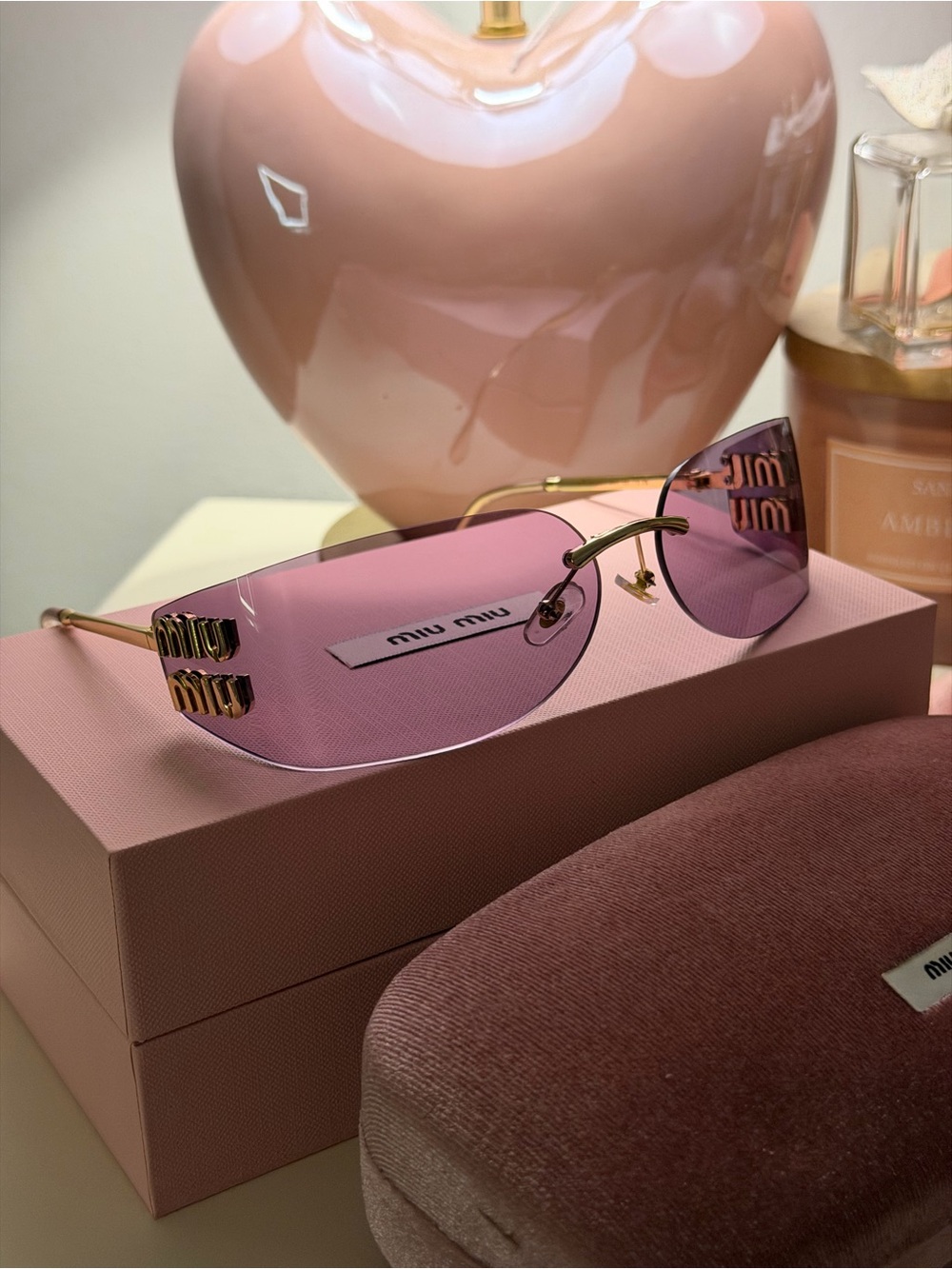 Miu Miu Gold-Trim Pink Rimless Sunglasses